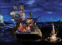 Guests enjoy the boat ride on the Pirates of the Carribean attraction inside the Magic Kingdom theme park.